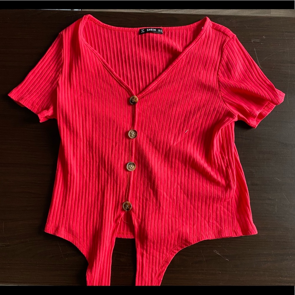 Red shirt with tie in the front